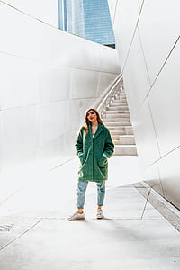 woman wearing green coat thumbnail