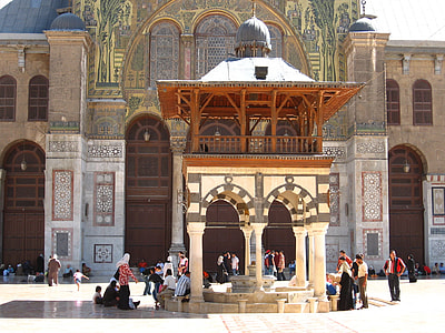 people standing beside gazebo at daytime thumbnail