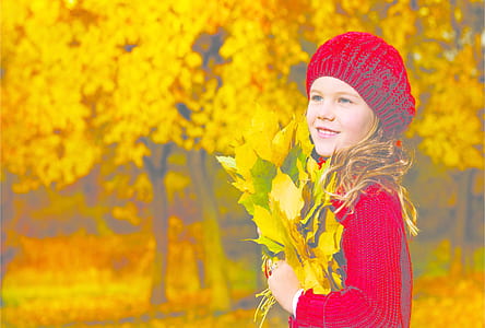 woman holding maple leafs thumbnail
