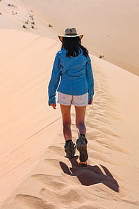 woman walking on desert thumbnail
