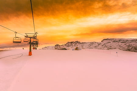 snowy mountain summit under cloudy day sky thumbnail