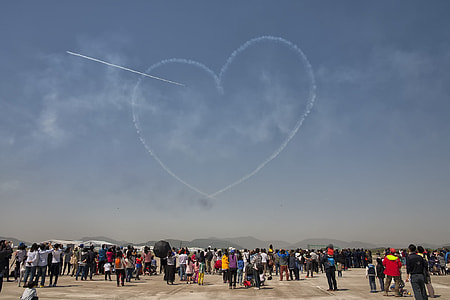 people gathered under blue sky thumbnail