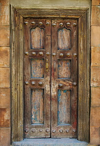 person taking photo of brown wooden door thumbnail