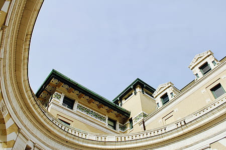 worm's-eye view photography of beige building thumbnail