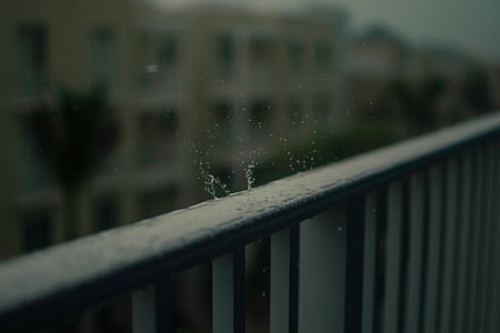 selective focus photo of water droplets on metal rails thumbnail