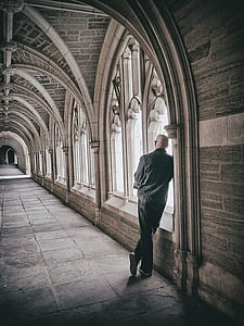 man leaning on wall thumbnail