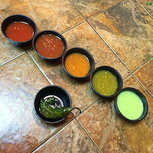 assorted spices in black bowls thumbnail