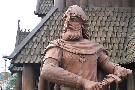 gladiator holding knife statue near house thumbnail
