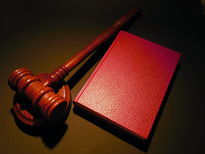 selective focus photography of gavel and red book thumbnail
