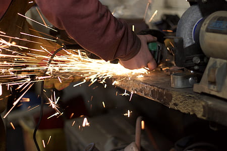 person wearing brown sweater holding circular saw thumbnail