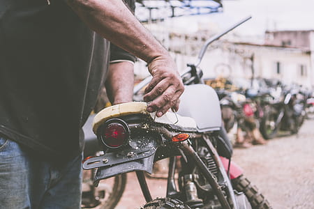 person fixing motorcycle thumbnail