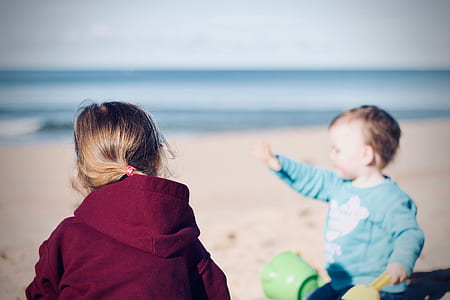 children on beach photo during daytime thumbnail