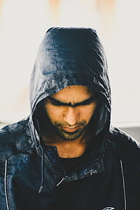 Man in Black Jacket While Looking Down thumbnail