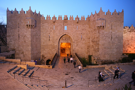 crowd of people outside castle during golden hour thumbnail