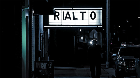 person standing near Rialto signage thumbnail