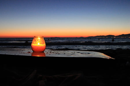 lighted candle on table thumbnail