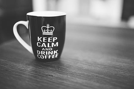 black and white ceramic mug with keep calm and drink coffee print on gray surface thumbnail