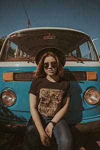 woman sitting in front of Volkswagen T1 van thumbnail
