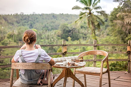 woman sitting outside terrace thumbnail