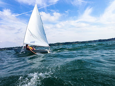 person on white sailboat thumbnail