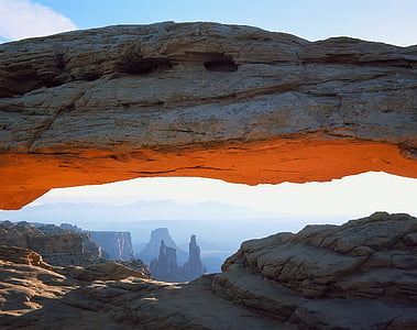 brown rock formation under blue skies at daytime thumbnail