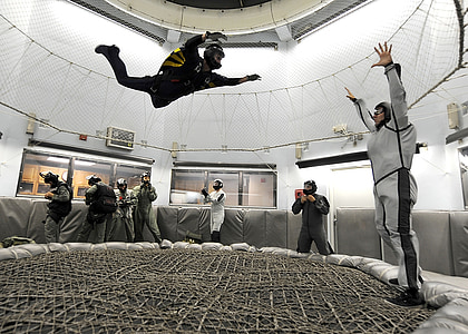 people inside air simulator practicing sky diving thumbnail