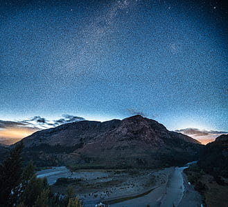 rocky mountain under blue skies thumbnail