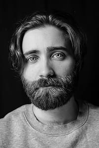 grayscale photo of man's portrait thumbnail