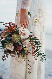 Woman Holding Bouquet of Flowers thumbnail
