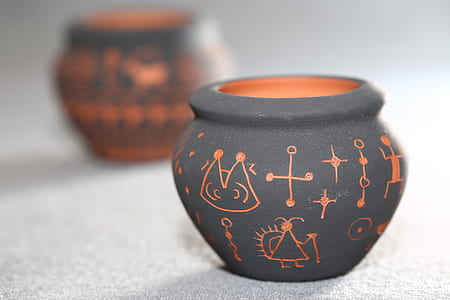 selective focus photography of gray and orange pot thumbnail