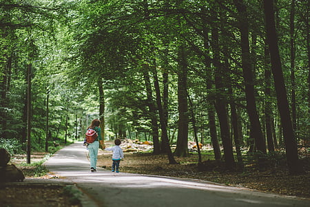 woman and toddler walking along the road thumbnail