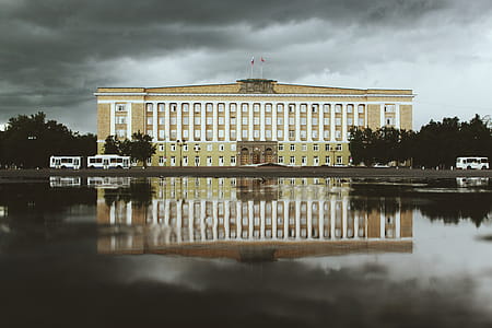 White and Beige Concrete Building Near Water thumbnail