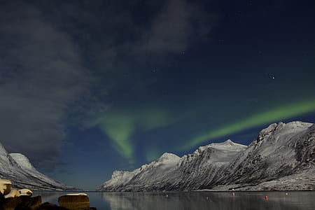 photo of mountain under blue sky thumbnail