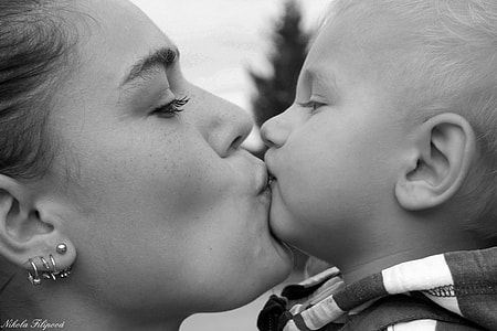 photo of woman kissing her son thumbnail