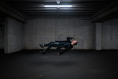 man in black suit hovering while drinking thumbnail