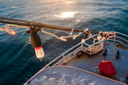 black string light on boat thumbnail