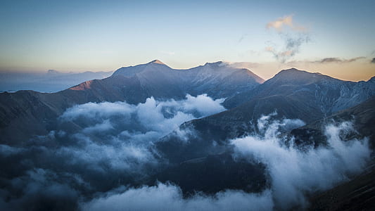 Photography of Mountain With Blue Sky As Backgroundw thumbnail