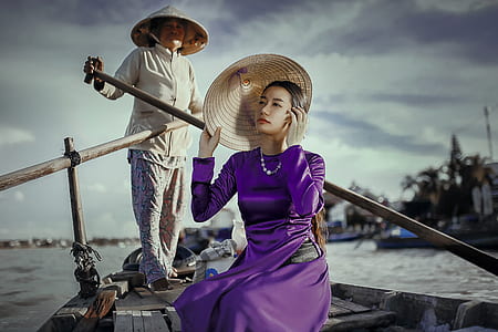 woman wearing purple silk long-sleeved dress on brown wooden boat thumbnail