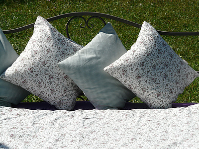 white-and-gray throw pillows on bench thumbnail
