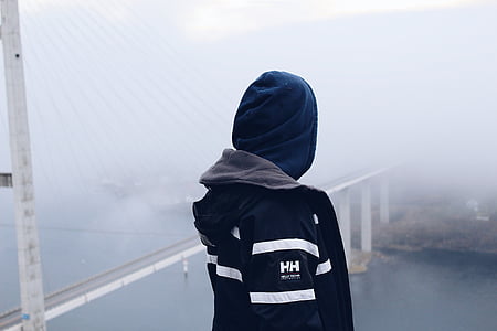 person facing body of water thumbnail