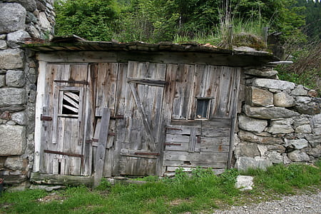 brown wooden cabin with closed door thumbnail