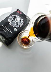 person pouring mixed Death Wish Coffee in cup thumbnail