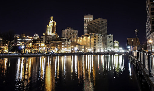 Skyline of Providence, Rhode Island at nighttime over the water thumbnail