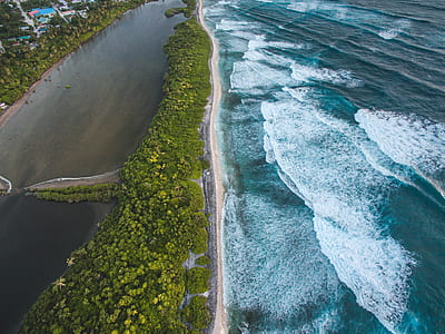 aerial photography of island during daytime thumbnail