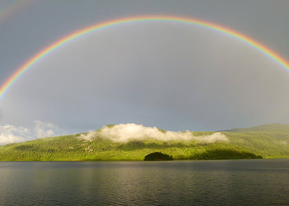 rainbow on top of green hills thumbnail