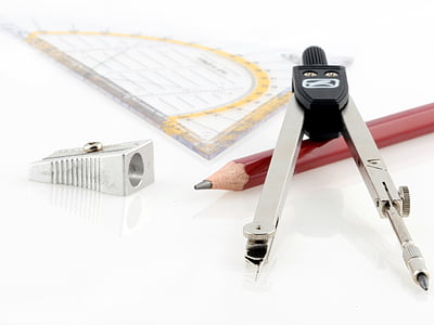 red pencil beside grey and black graphing compass and grey sharpener thumbnail