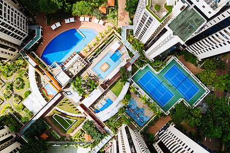 aerial photo of swimming pool and white buildings during daytime thumbnail