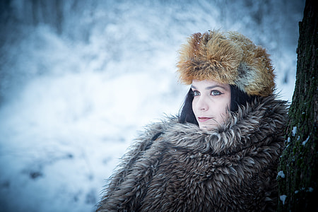 vignette photography of woman wearing brown fur jacket and hat thumbnail
