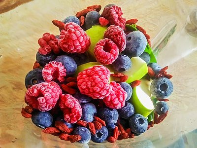 red and blue berries in glass bowl thumbnail