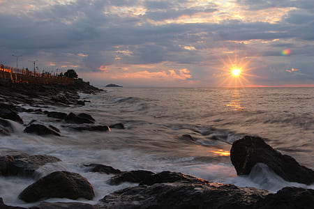 Rocks on Seashore during Sunset thumbnail